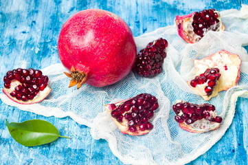 Pomegranate fruit on a wooden table