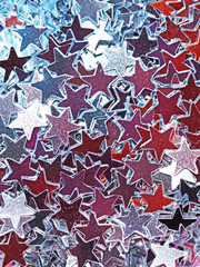 Obraz premium mirrored multicolored stars, Christmas background, confetti