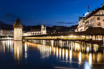 Fototapeta na wymiar Famous wooden bridge in Lucerne at night in Switzerland