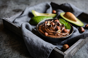 Raw avocado chocolate mousse with hazelnuts