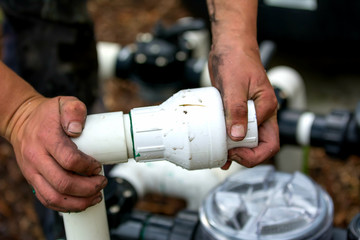 man working with PVC pipe