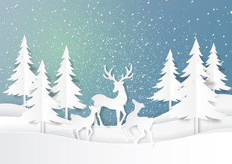 Naklejka premium Nature landscape and deers family joyful on snow winter background.For merry christmas and happy new year paper art style.Vector illustration.