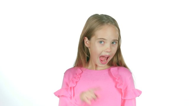 Child girl is making faces. White background. Slow motion