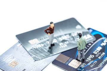 Miniature people : small figures businessmen stand on Credit Card with copy space and using as background team competition concept, business plan concept,Stock Exchange concept, Online payment 
