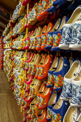 Set of different colorful vintage Dutch wooden clogs on display