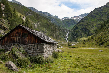 Old barn with stone walls in dolomite valley