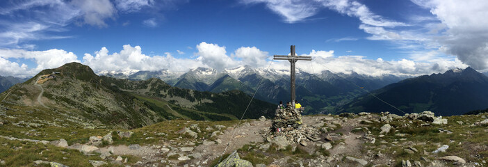 Mountain peak with cross in the european alps