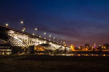 Poniatowski bridge over the Vistula river at night in Warsaw, Poland