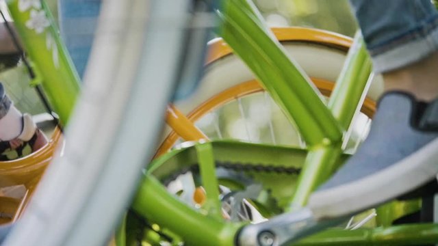 Slow motion shot of detail of bycicle wheels. Modern concept of ecological transportation.