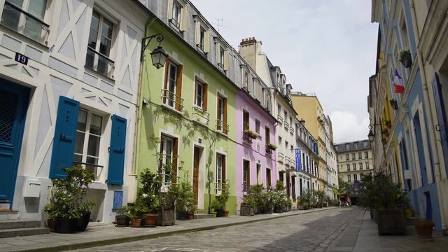Nice street with colorful houses and cozy hotel in France, hospitality business