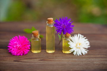 aster essential oil in  beautiful bottle on table