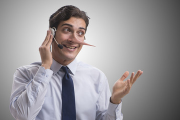 Businessman on the phone lying to his opponent