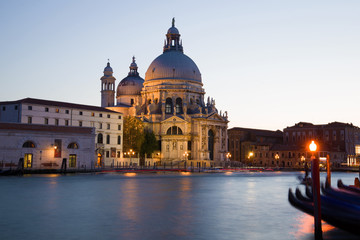 Fototapeta na wymiar Cathedral of Santa Maria della Salute on the Grand Canal in September twilight. Venice, Italy