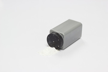 Baby talcum powder on white table background