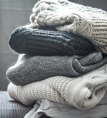 Fototapeta na wymiar A stack of knitted sweaters