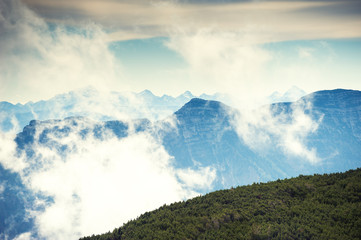 Mountain peaks in foggy morning. Beautiful landscape in Austrian Alps