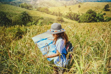 Asian women travel relax in the holiday. Expand survey map Mountain field. Thailand