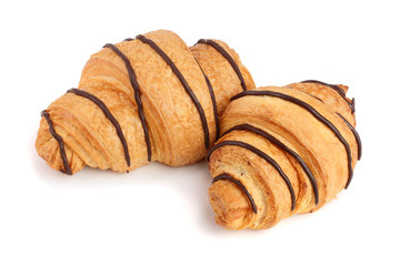 croissant decorated with chocolate sauce isolated on white background, top view