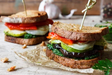 Fotobehang sandwich with grilled vegetables and pesto sauce © yuliiaholovchenko