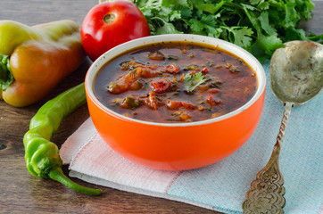 Bowl of traditional soup Borscht on table