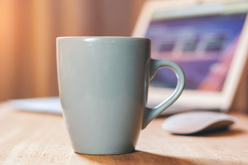 Grey mug on the desktop