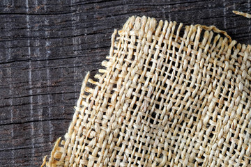 Wood table with old sackcloth burlap tablecloth texture
