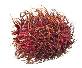 Naklejka premium Red unpeeled rambutan fruit isolated on white background