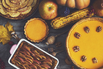 Autumn background. Homemade Pumpkin, apple Pies for Thanksgiving Ready to Eat. Design mock up