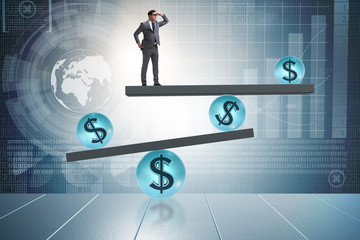 Businessman balancing in financial dollar concept