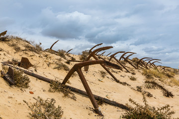 Natural Cemetery of Marine Anchors at Barril Beach, Portugal