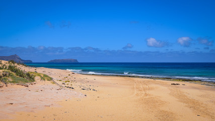 Fototapeta na wymiar Golden sand beach and turquoise Atlantic Ocean at Porto Santo Island, Portugal