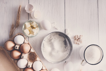 Baking ingredients on rustic white background