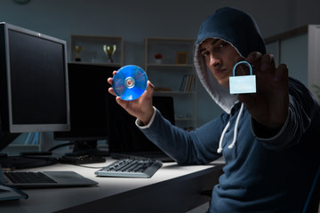 Hacker hacking computer at night