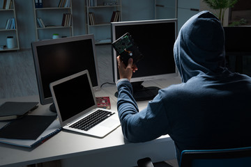 Hacker hacking computer at night