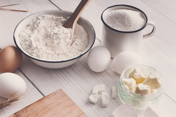 Baking ingredients on rustic white background