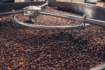 Close up grains locating in spinning cooler professional machine. Work concept