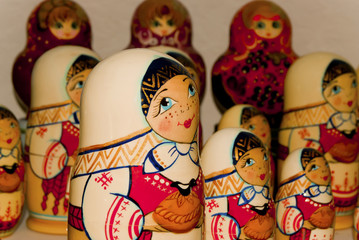 A set of traditional Russian wooden hand-painted dolls matryoshkas of various sizes closeup..