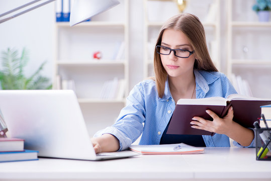 Young teenage female student preparing for exams at home - Powered by Adobe
