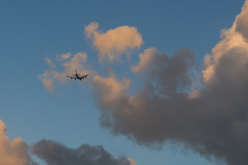 Fototapeta na wymiar Jumbo jet going through clouds