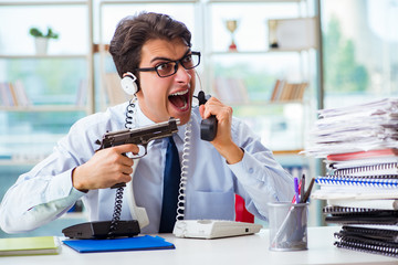 Unhappy angry call center worker frustrated with workload
