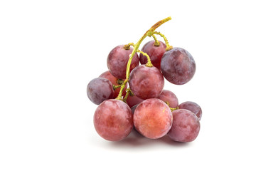 Ripe red grape with drops isolated on white.