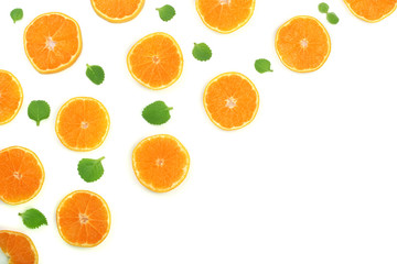 Slices of orange or tangerine with leaves isolated on white background with copy space for your text. Flat lay, top view