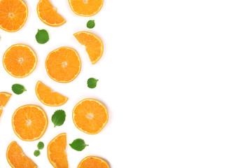 Slices of orange or tangerine with leaves isolated on white background with copy space for your text. Flat lay, top view