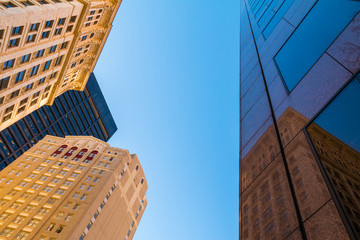 Fototapeta na wymiar Bottom view of office skyscrapers on the background of clear sky, Atlanta, USA