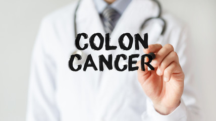 Doctor writing word Colon Cancer with marker, Medical concept