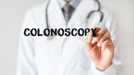 Doctor writing word Colonoscopy with marker, Medical concept