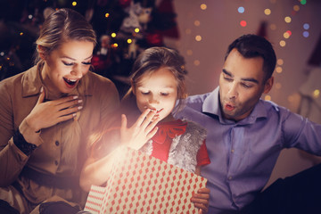 Happy Family Opening Christmas Present