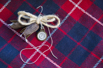 Handmade brooch on checkered background