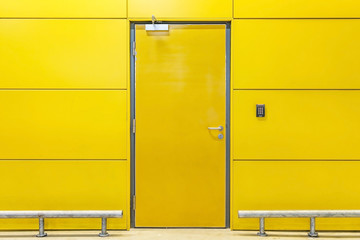 Closed door yellow building interior walls, construction