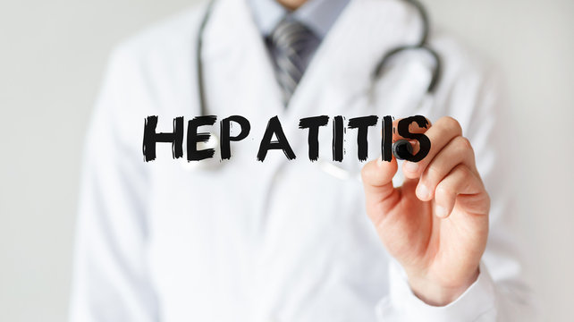 Doctor writing word Hepatitis with marker, Medical concept